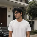 A man wearing glasses looking to the side