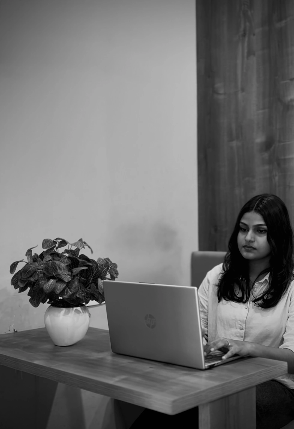 freelance digital marketer in Alappuzha working on laptop in a professional workspace.